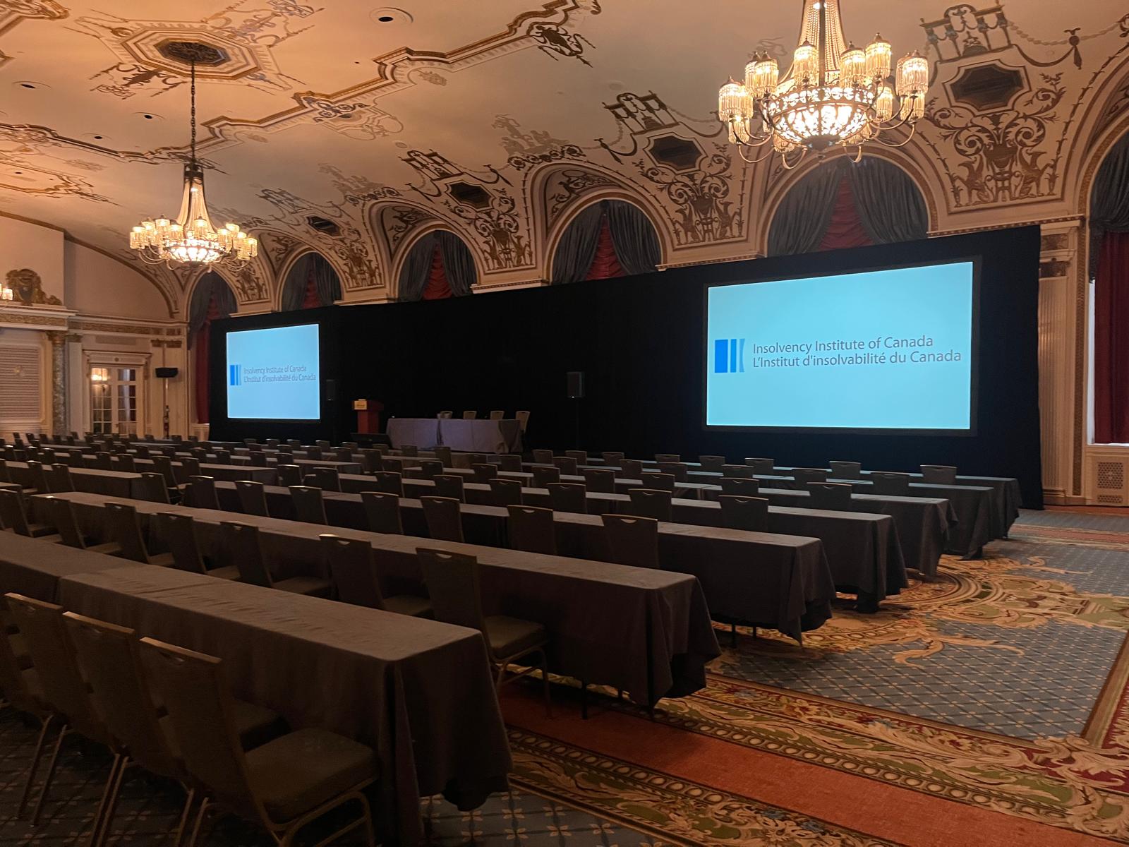 Configured conference presentation room with dual projection screens
